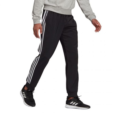 Spodnie adidas Essentials Tapered Cuff 3 Stripes M GK8980 Spodnie adidas Essentials Tapered Cuff 3 Stripes M GK8980