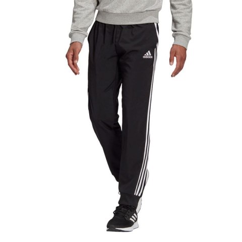Spodnie adidas Essentials Tapered Cuff 3 Stripes M GK8980 Spodnie adidas Essentials Tapered Cuff 3 Stripes M GK8980